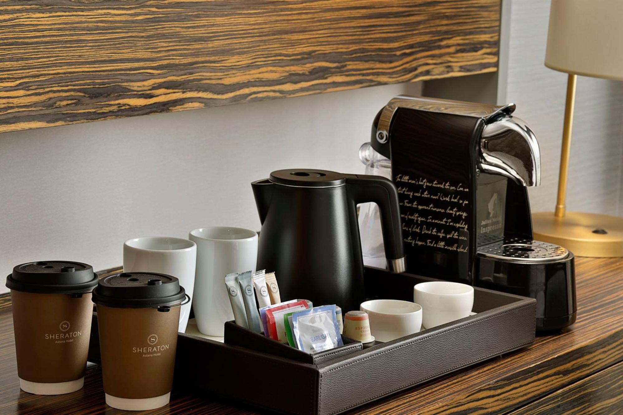 Sheraton Astana Hotel Exterior foto A Nespresso coffee machine in a hotel room